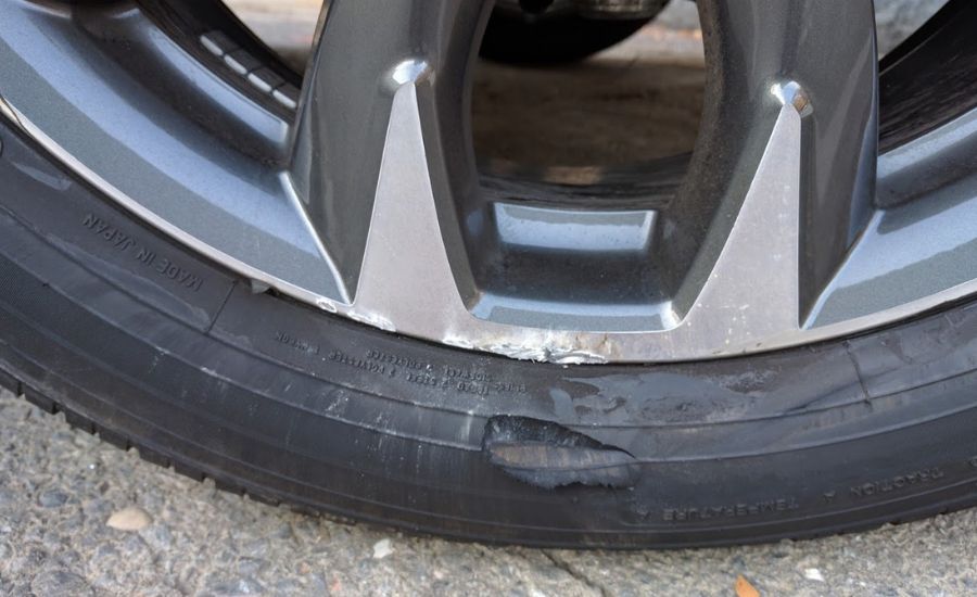 small chunk of tire sidewall missing